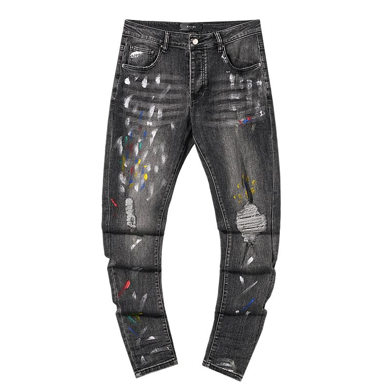 AMIRI Paint-Splatter Distressed Jeans — hero